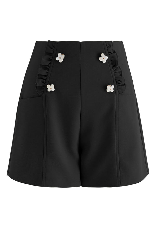 Ettie - Söta shorts med blomstermanschett och volang i svart